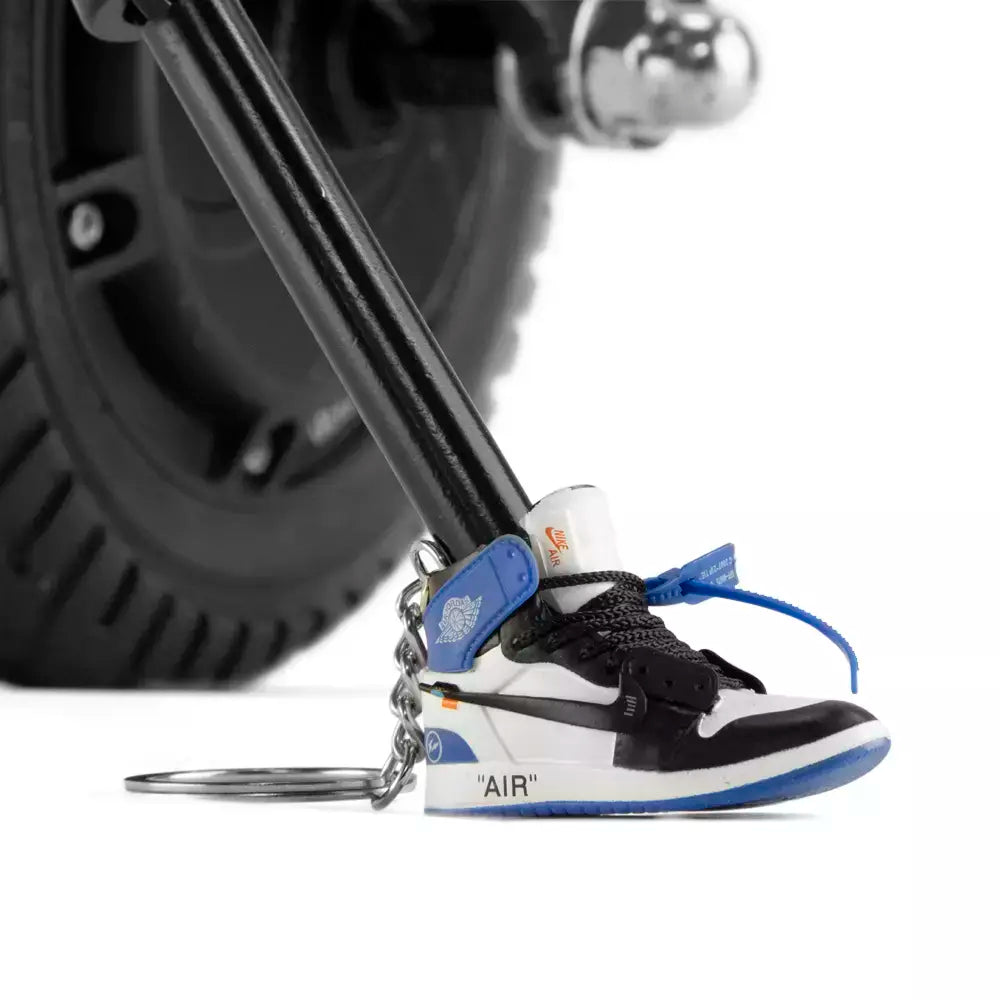 Blue Jordan Keychain On Scooter Kickstand