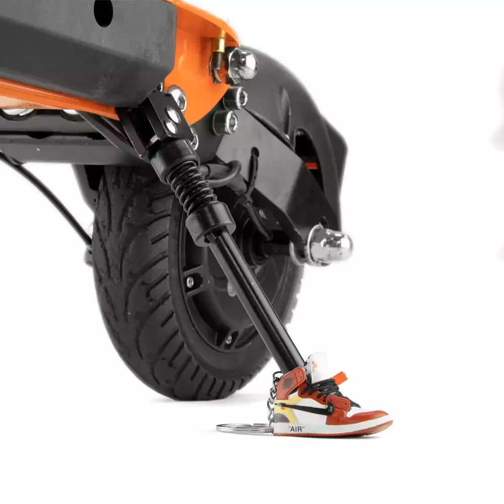 Red Jordan Keychain On Scooter Kickstand